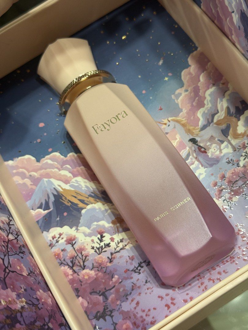 Fayora by Paris Corner (Category: Fragrance & Deodorants) located in Pasay City. Submitted by itskshop (Listing ID 1466794800, Image 3). Description: - Item: Fayora by Paris Corner Eau de Parfum - Condition: 95% full. Only few sprays missing. Comes with original packaging/box na super pretty - Presentation: Gorgeous fantasy-themed box with mountain and unicorn art - Bottle: Gradient pink to purple design with gold lettering and decorative cap - F