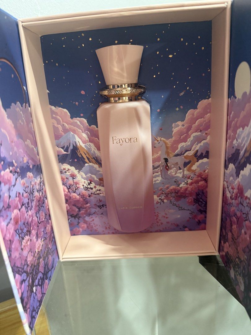 Fayora by Paris Corner (Category: Fragrance & Deodorants) located in Pasay City. Submitted by itskshop (Listing ID 1466794800, Image 1). Description: - Item: Fayora by Paris Corner Eau de Parfum - Condition: 95% full. Only few sprays missing. Comes with original packaging/box na super pretty - Presentation: Gorgeous fantasy-themed box with mountain and unicorn art - Bottle: Gradient pink to purple design with gold lettering and decorative cap - F