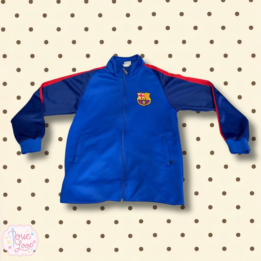 FC Barcelona Blue Track Jacket (Category: Coats, Jackets and Outerwear) located in Manila. Submitted by love.loop (Listing ID 1466890535, Image 1). Description: - Official FC Barcelona colors in iconic blue and red - Features embroidered team crest on the chest - Full zip closure with a comfortable stand-up collar - Stylish red accent stripes on shoulders and sleeves - Practical side pockets for your essentials - Ribbed cuffs and hem for a snug f