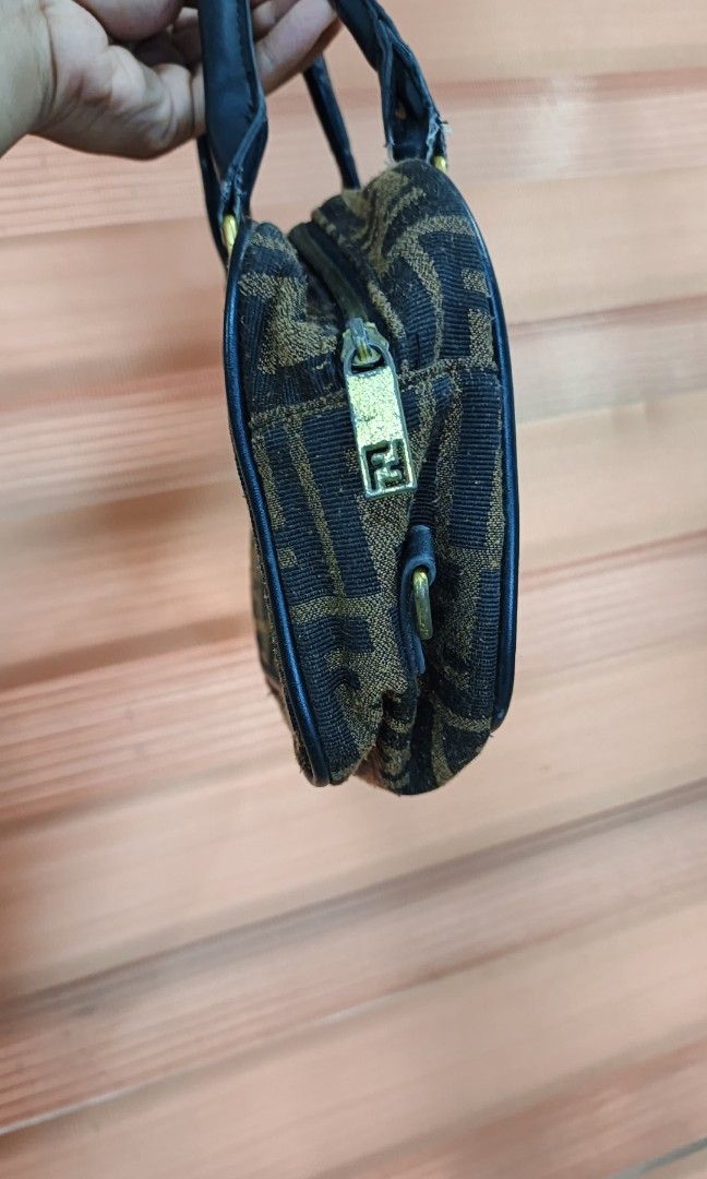 Fendi Zucca Monogram Hand Bag (Category: Purses & Pouches) located in Cabuyao City. Submitted by dthrifts (Listing ID 1466851700, Image 3). Description: 9.5 W 7 L Missing Sling Strap Used Condition.