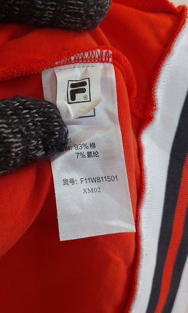 Fila track jacket (Category: Activewear) located in Pozorrubio. Submitted by infinite_grind_0.1 (Listing ID 1466817615, Image 3). Description: 285 This is a red Fila track jacket with white-and-navy-blue striped ribbing, similar to the classic Fila Settanta design on tape: chest 16 length 21.