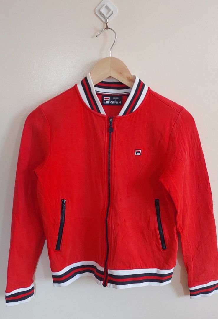 Fila track jacket (Category: Activewear) located in Pozorrubio. Submitted by infinite_grind_0.1 (Listing ID 1466817615, Image 1). Description: 285 This is a red Fila track jacket with white-and-navy-blue striped ribbing, similar to the classic Fila Settanta design on tape: chest 16 length 21.