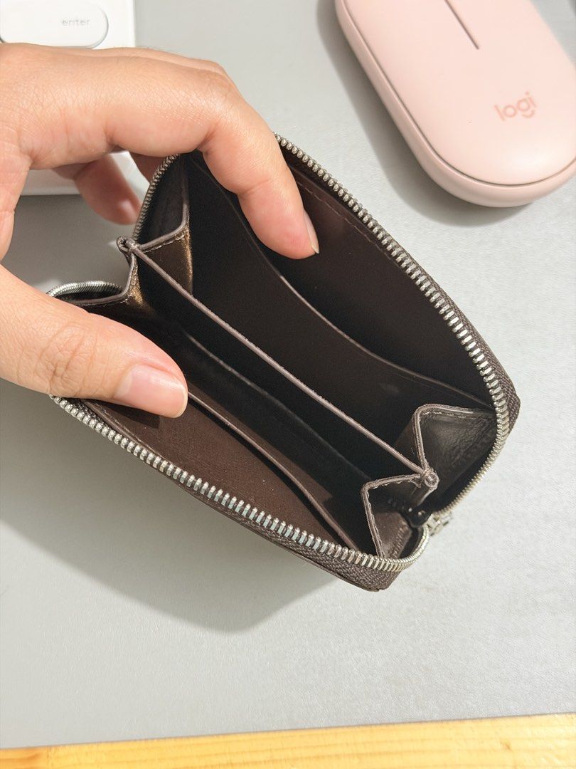 Fino Leatherware Brown Zippered Card Wallet (Category: Wallets & Card holders) located in San Pedro. Submitted by pandamate (Listing ID 1466922086, Image 3). Description: - Brand: Fino Leatherware - Material: Premium dark brown leather - Design: Compact zip-around wallet with a smooth zipper and matching pull tab - Storage: Multiple interior card slots and compartments for optimal organization - Exterior: Convenient slip pocket on the back - Cond