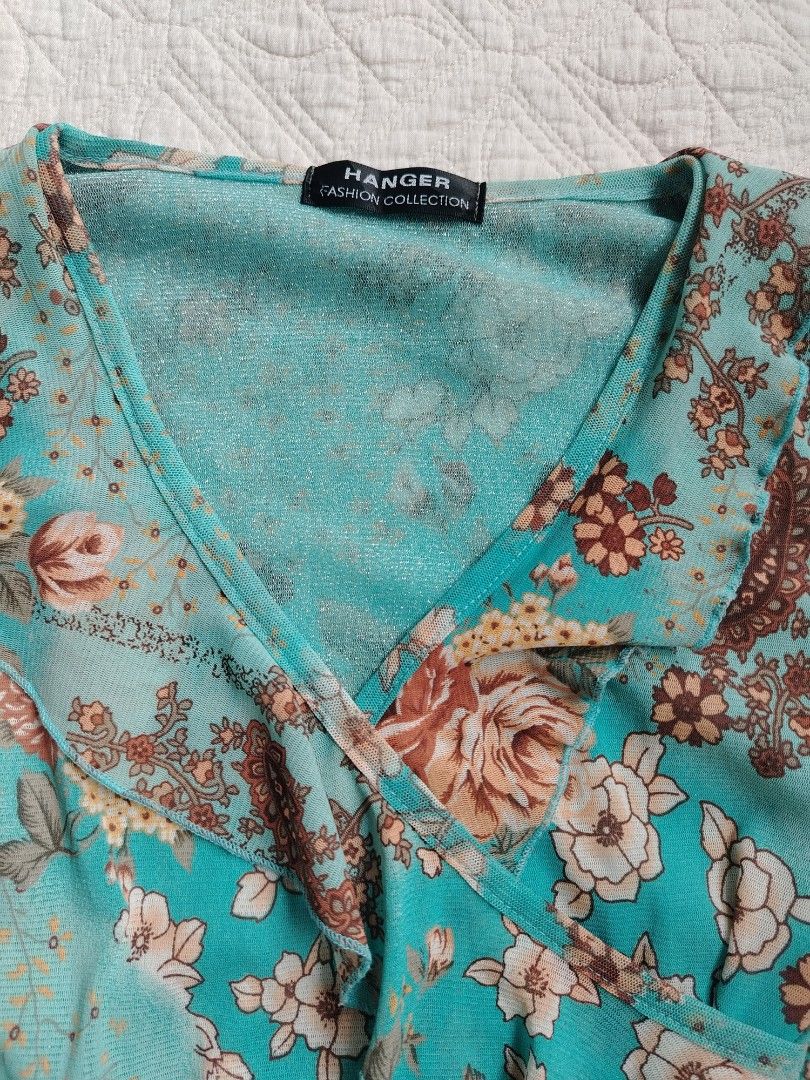 Floral blue wrap top (Category: Blouses) located in Panabo. Submitted by _elfiethreads (Listing ID 1466878724, Image 2). Description: Small-med No flawss!.