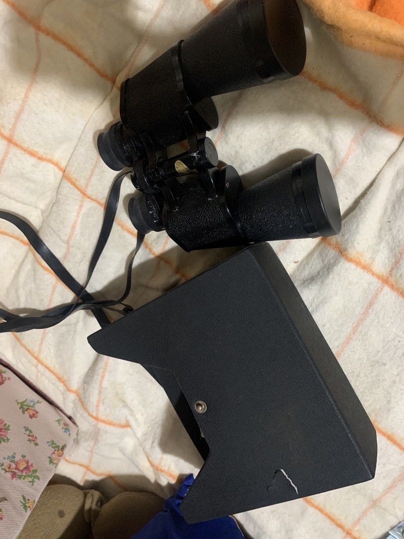 Fokus 7x50 Field 7.1 Binoculars with Case (Category: Hiking & Camping) located in Malolos. Submitted by rubyche88 (Listing ID 1466889955, Image 3). Description: - Brand/Model: Fokus 7x50 binoculars - Field of view: 124m at 1000m - Design: Black textured body with adjustable eyepieces and attached neck strap - Includes: Matching hard storage case with snap button closure - Condition: Optics and body show typical signs of handling and dust - Best f