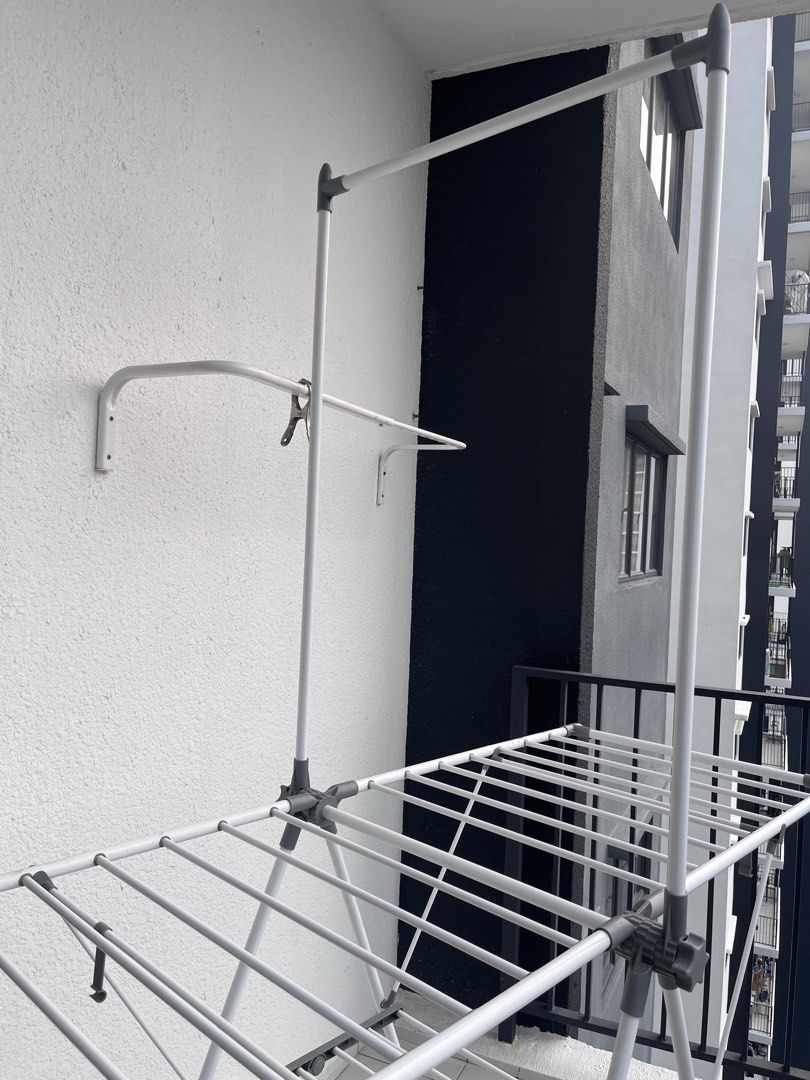 Foldable Drying Rack (Category: Clothes Drying Rack) located in Puchong. Submitted by amalhalim (Listing ID 1466777074, Image 2). Description: - Type: Foldable Clothes Drying Rack - Color: White and Grey - Design: Space-saving collapsible design with multiple drying rails, ideal for condo/apartment balconies - Condition: Good, sturdy, and fully functional - Storage: Easy to fold flat when not in use - Bought for RM 130+, selling cheaper - Only av