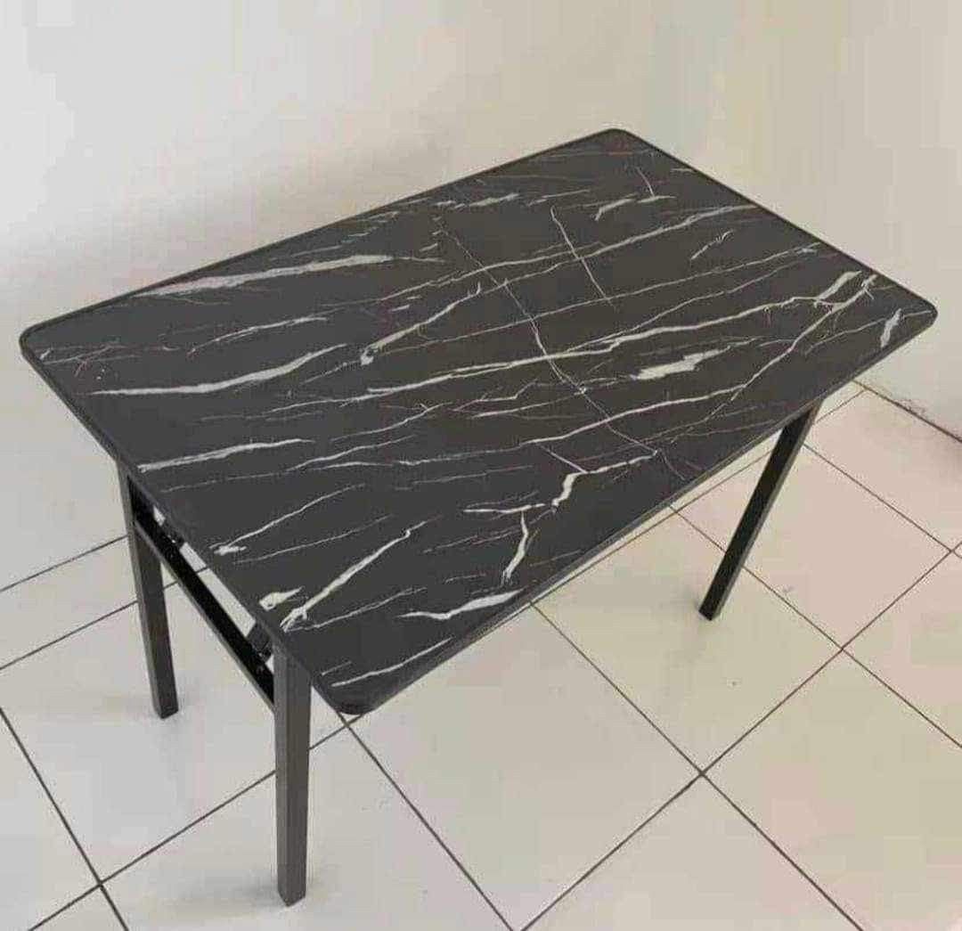Foldable Marble Pattern Dining Study Table (Category: Tables & Sets) located in Manila. Submitted by jamfrimzy089458 (Listing ID 1466797371, Image 1). Description: - Sleek black marble pattern surface that adds a modern touch - Sturdy black metal legs and steel frame for durability - Folds completely flat for effortless storage and portability - Ideal for study sessions, work-from-home setups, dining, or compact spaces - Low-maintenance and easy 
