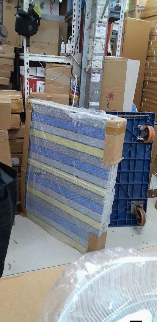 Foldable Single Bed with Striped Mattress (Category: Bed Frames & Mattresses) located in Caloocan City. Submitted by swiftflower_802790 (Listing ID 1466948105, Image 2). Description: - Foldable single bed with sturdy white metal frame - Comfortable mattress with blue, yellow, and grey stripes - Folds in half easily for compact storage and moving - Great space saver ideal for small rooms or unexpected guests.