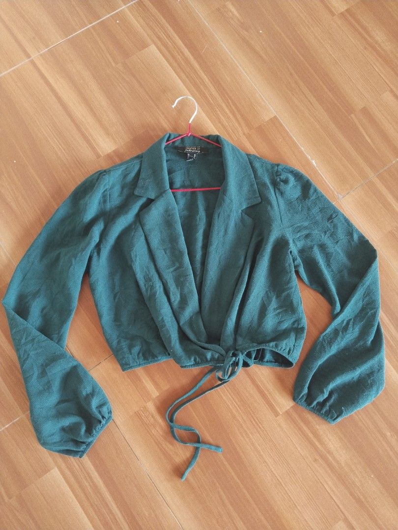 Forever 21 Emerald Green Cropped Tie-Front Blouse — Size S (Category: Longsleeves) located in Mabalacat. Submitted by al_amin_thrift (Listing ID 1466866718, Image 1). Description: Forever 21 Emerald Green Cropped Tie-Front Blouse — Size S ✔️ Authentic Forever 21 Contemporary — Made in Vietnam ✔️ Rich emerald green — elegant & versatile ✔️ Blazer-style lapel collar with deep V-neck ✔️ Self-tie detail at waist — adjustable fit ✔️ Long balloon sleev