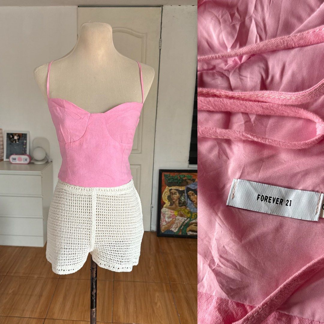 Forever 21 Pink Crop Top (Category: Sleeveless) located in Naga. Submitted by maartsy.co (Listing ID 1466884670, Image 1). Description: - Brand: Forever 21 - Color: Bright pink - Style: Structured bustier crop top with thin spaghetti straps - Back detail: Trendy strappy back design - Fit: Cropped and lightweight, ideal for warm weather - Condition: Great pre-loved condition.