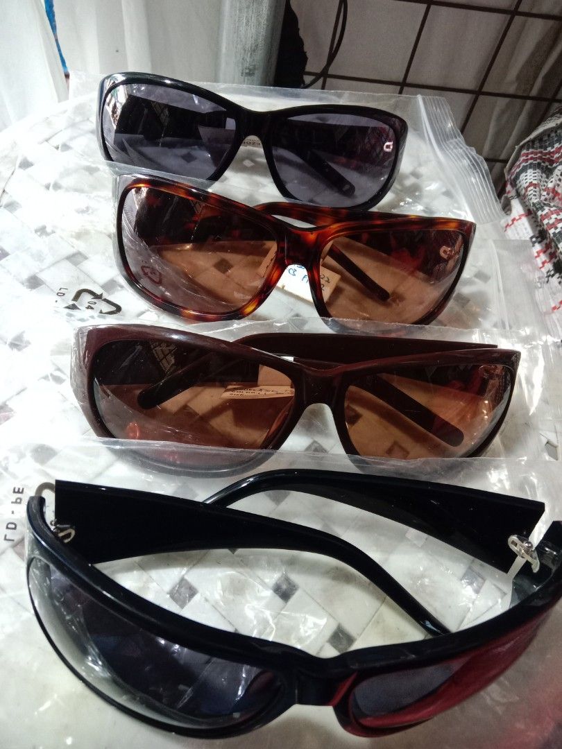 Fossil Sunglasses Assorted Styles (Category: Sunglasses & Eyewear) located in Rosario. Submitted by gmarilyn1934608 (Listing ID 1466776289, Image 1). Description: - Brand assortment: Includes Fossil and Lezoptics Manufacturing Ltd frames - Diverse designs: Classic tortoiseshell and sleek black frames - Lens options: Various tints ranging from dark to amber - Unique details: Features distinct side patterns and temple designs - Versatile use: Perfe