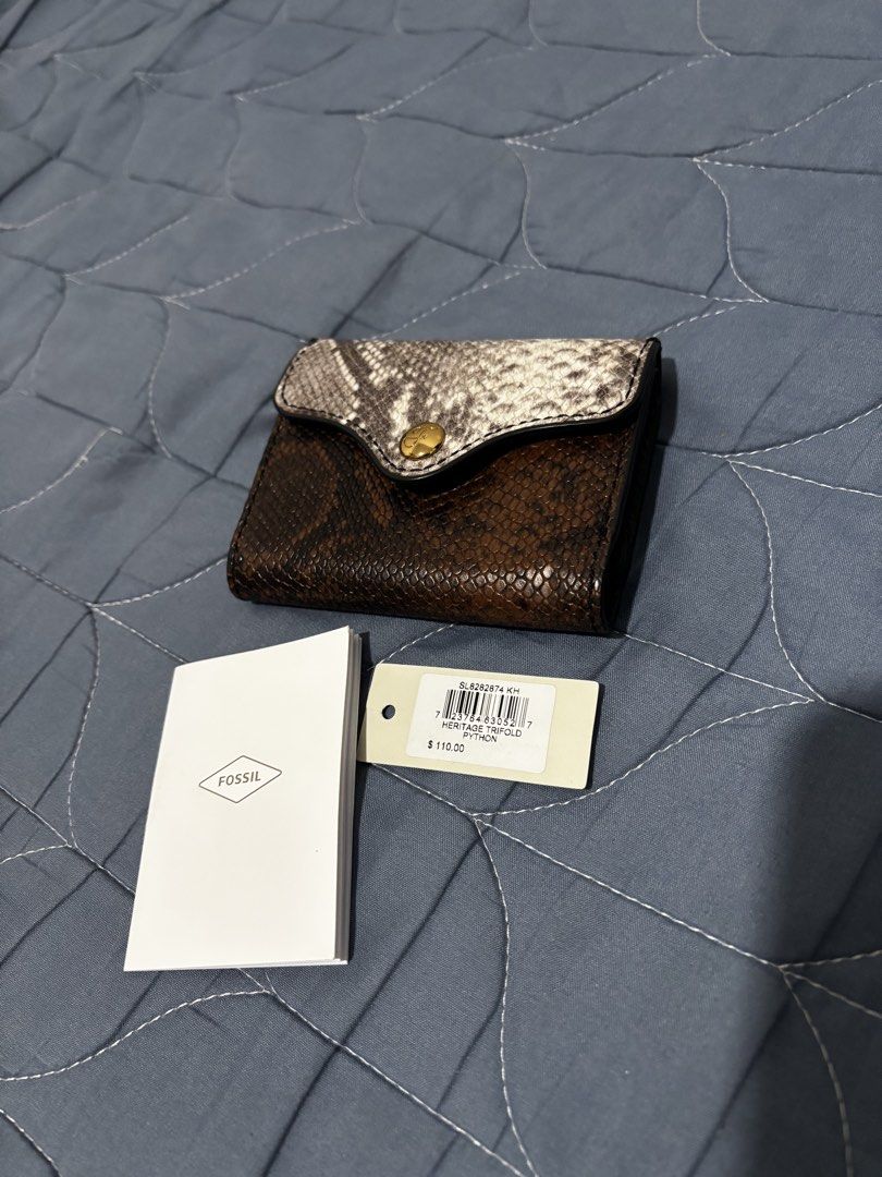 Fossil Wallet (Category: Wallets & Card holders) located in Manila. Submitted by declutter_byjaq (Listing ID 1466936748, Image 1). Description: Fossil Heritage Trifold Wallet - Python Brandnew With Tag and Care Card.