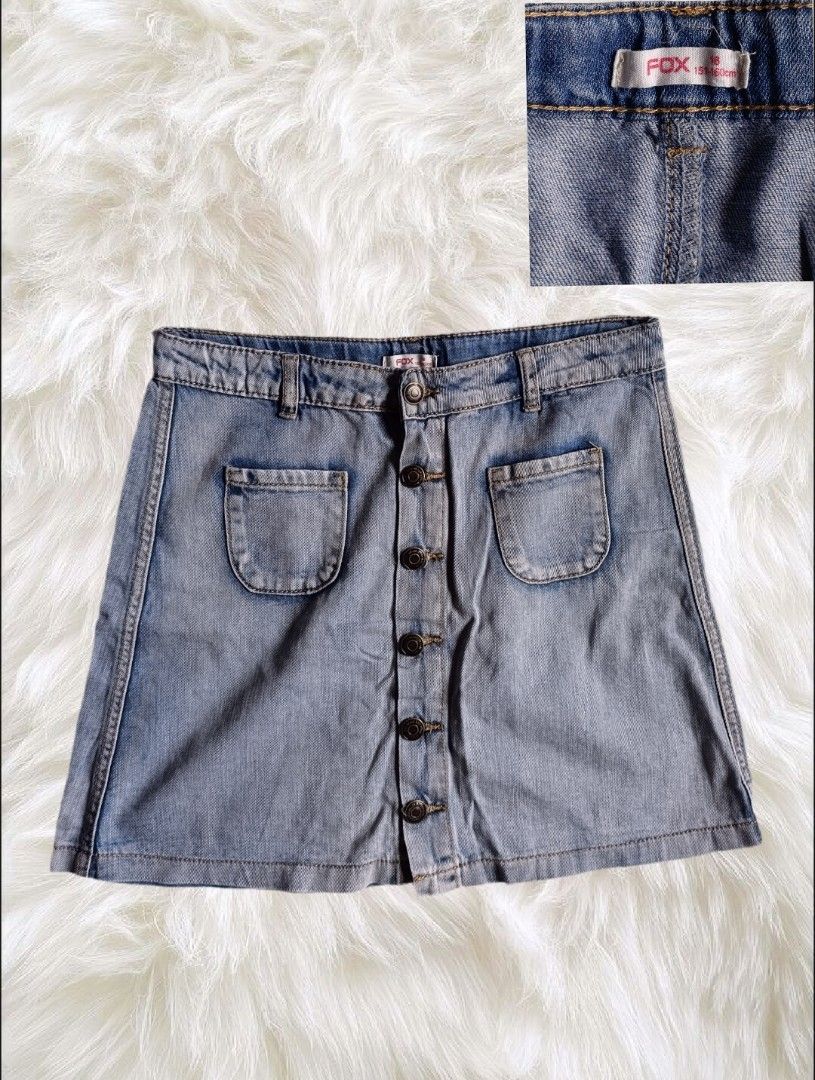 FOX Denim Skirt Button Front Size 18 151-160cm (Category: Skirts) located in Abucay. Submitted by lovedby.herrr (Listing ID 1466827113, Image 1). Description: FOX light wash denim skirt in size 18 (fits 151-160cm height). Features a classic button-front design, front pockets, and belt loops. Perfect for casual everyday wear..