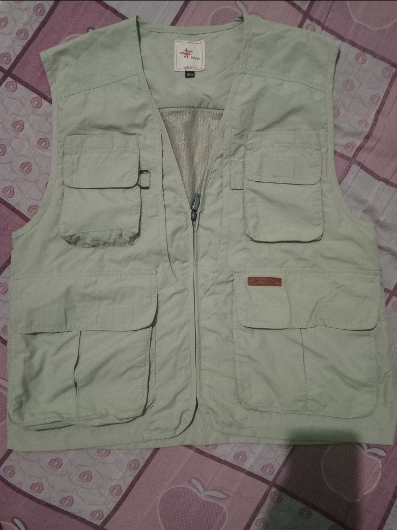 Foxfire Multi Pocket Utility Vest Beige Medium (Category: Vests) located in Dasmarinas. Submitted by francoprancisco (Listing ID 1466868298, Image 2). Description: - Brand: Foxfire - Color: Beige - Size: Medium - Multiple front pockets with flaps and velcro closures - Breathable mesh interior lining on front and back - Full front zip closure with metal pull - Convenient D-ring near right chest pocket - Ideal for fishing, hiking, and outdoor trips