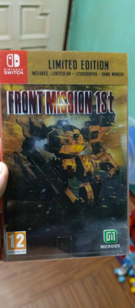 Front Mission 1st Limited Edition Nintendo Switch Game (Category: Nintendo) located in Malabon City. Submitted by joewardabrera (Listing ID 1466967326, Image 1). Description: - Title: Front Mission 1st Limited Edition - Platform: Nintendo Switch (Physical Cartridge) - Publisher: Microids - Age Rating: PEGI 12 - Inclusions: Lenticular cover, exclusive lithographs, and physical game manual - Genre: Tactical strategy / Mech combat.