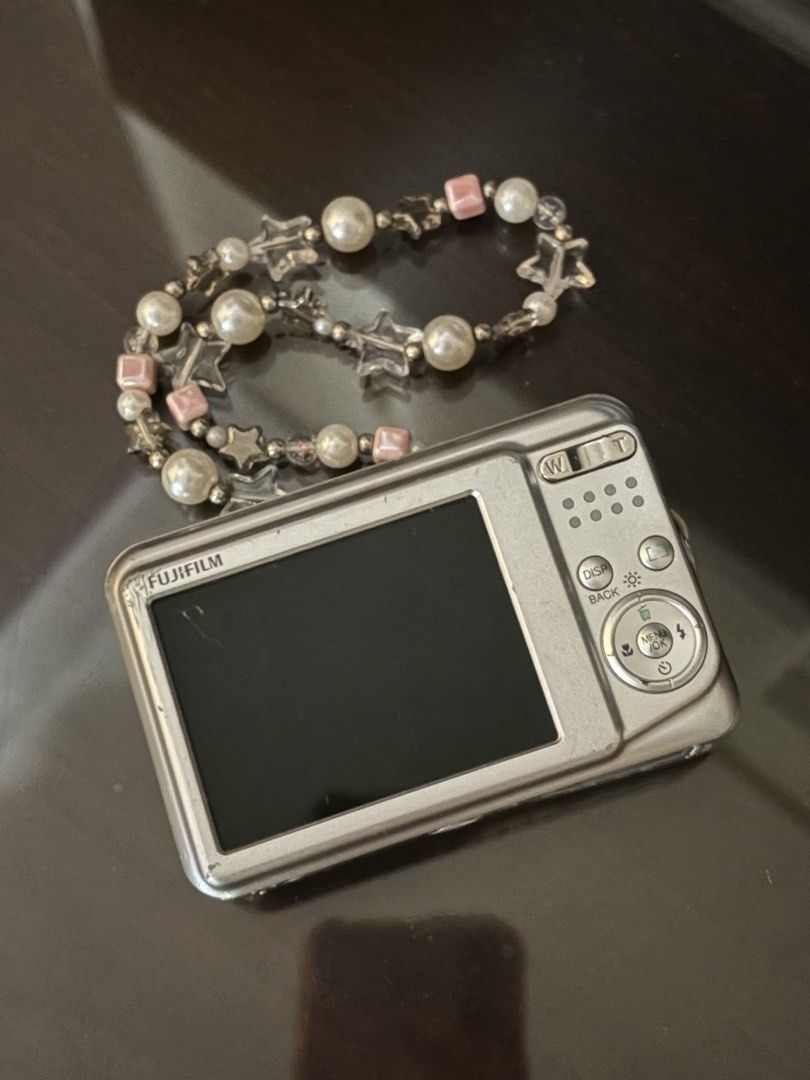 Fujifilm FinePix A170 Digicam (Category: Cameras) located in Quezon City. Submitted by alex.c_1 (Listing ID 1466790702, Image 2). Description: - Model: FujiFilm FinePix A170 - Resolution: 10.2 Megapixels - Condition: Normal signs of handling on the body, LCD screen works perfectly - Vibe: Perfect Y2K aesthetic pocket camera for daily snapshots and OOTDs.