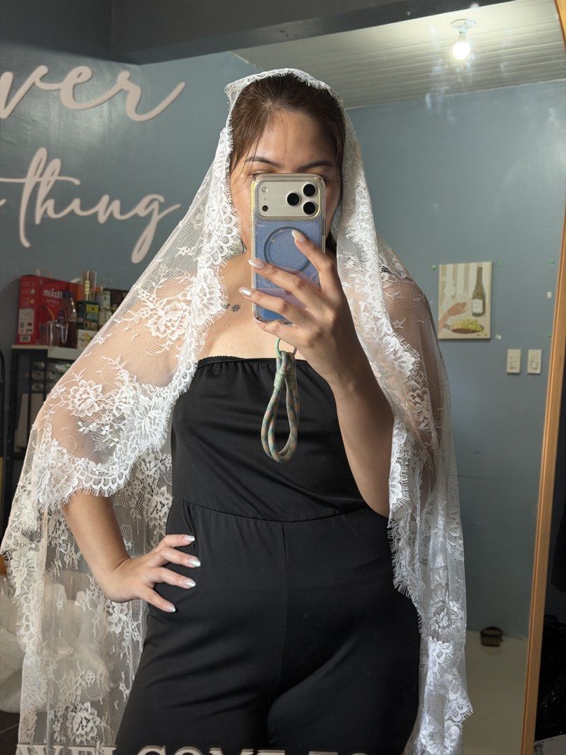 Full Lace Mantilla Veil with Comb (Category: Evening dresses & gowns) located in Dasmarinas. Submitted by jeannemaika (Listing ID 1466806604, Image 1). Description: White bridal veil featuring floral lace trim along the edges. Includes a sewn-in metal hair comb for easy attachment. Long draped length covers the shoulders and back. Worn once for photos. Soft tulle material, clean condition, no tears or snags found. selling my unused Full Lace Mant