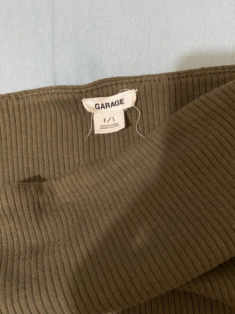 GARAGE Ribbed Tube Crop Top (Category: Sleeveless) located in Guinobatan. Submitted by jadieee_young22 (Listing ID 1466939587, Image 3). Description: No flaws or issues Size: Fits Small Material: Stretchy ribbed knit fabric Color: Muted Olive Green .
