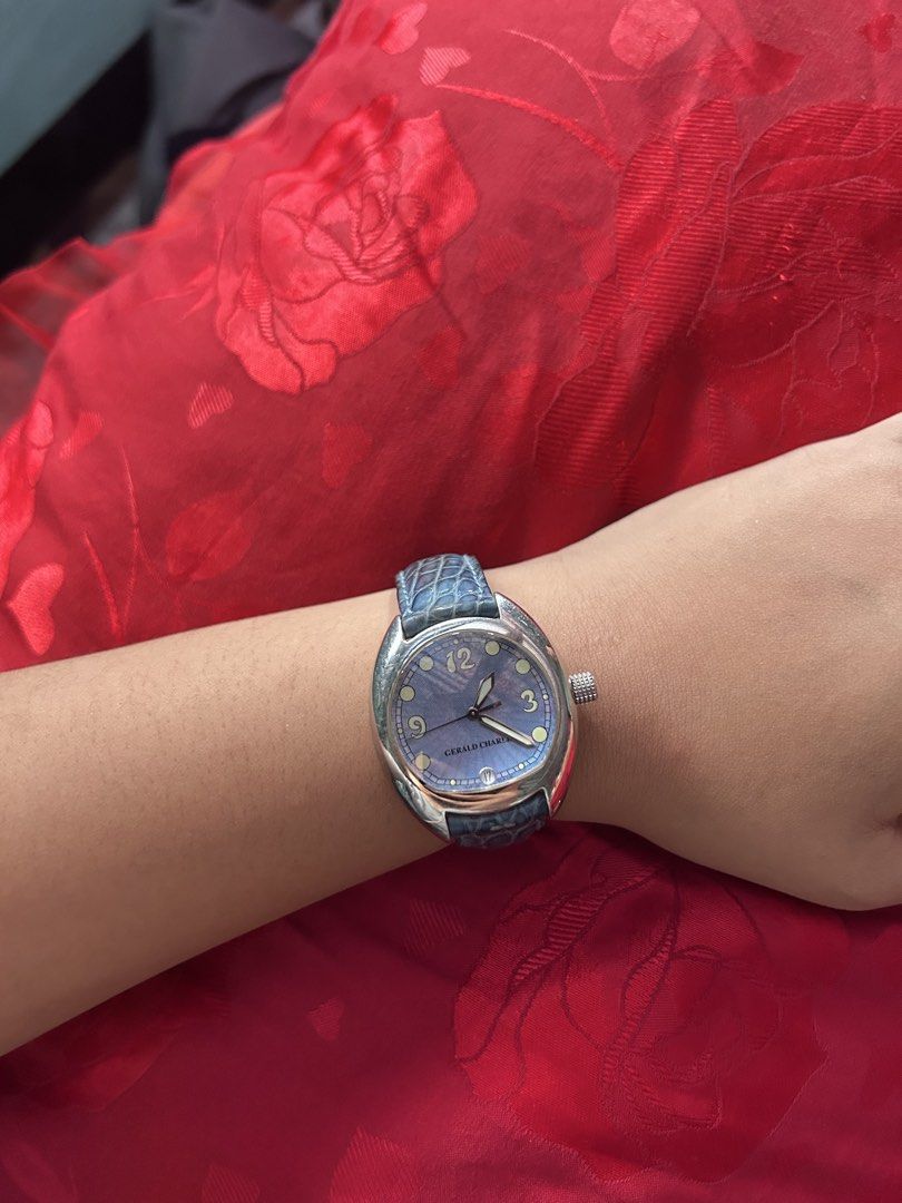 Gerald Charles Renaissance Blue Dial Leather Strap Watch (Category: Luxury Watches) located in Taguig. Submitted by mariachristina25 (Listing ID 1466844676, Image 1). Description: - Brand/Model: Gerald Charles Renaissance - Design: Distinctive asymmetrical stainless steel case designed by Gérald Genta - Dial: Textured blue dial with date window at the 6 o'clock position - Movement: Manual winding - Strap: Matching blue leather strap with engraved