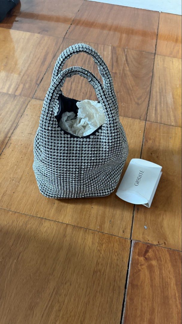 Giarite crystal top handle bag (Category: Cross-body Bags) located in Makati City. Submitted by thevault88 (Listing ID 1466859693, Image 1). Description: - Brand: Giarite - Style: Crystal-embellished top handle / bucket bag - Condition: Excellent pre-loved condition - Features: Full rhinestone bling coverage, structured flat base with protective metal feet, sturdy top handle - Includes: detachable chain strap - Perfect for: Parties, formal events