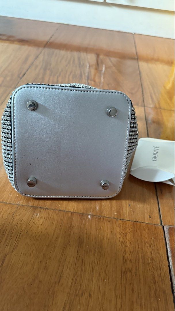 Giarite crystal top handle bag (Category: Cross-body Bags) located in Makati City. Submitted by thevault88 (Listing ID 1466859693, Image 3). Description: - Brand: Giarite - Style: Crystal-embellished top handle / bucket bag - Condition: Excellent pre-loved condition - Features: Full rhinestone bling coverage, structured flat base with protective metal feet, sturdy top handle - Includes: detachable chain strap - Perfect for: Parties, formal events