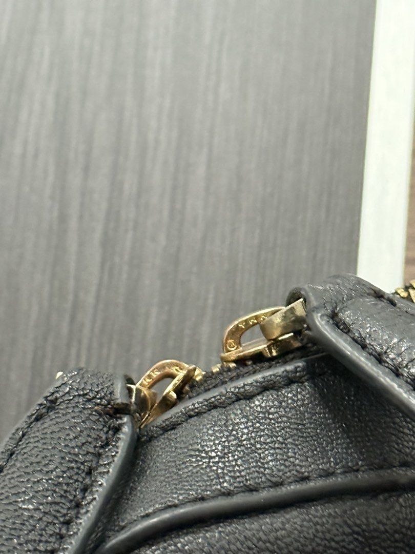 Givenchy Black Leather Handbag (Category: Luxury Bags & Wallets) located in Manila. Submitted by bilog_khairmuchuan (Listing ID 1466792705, Image 2). Description: - wAuthentic Givenchy black leather handbag - Elegant gold-tone zippers and hardware - Dual top handles for comfortable carrying - Secure top zip closure - Spacious fabric-lined interior fits daily essentials easily - Includes interior leather logo tag (Made in Italy) - Features authent