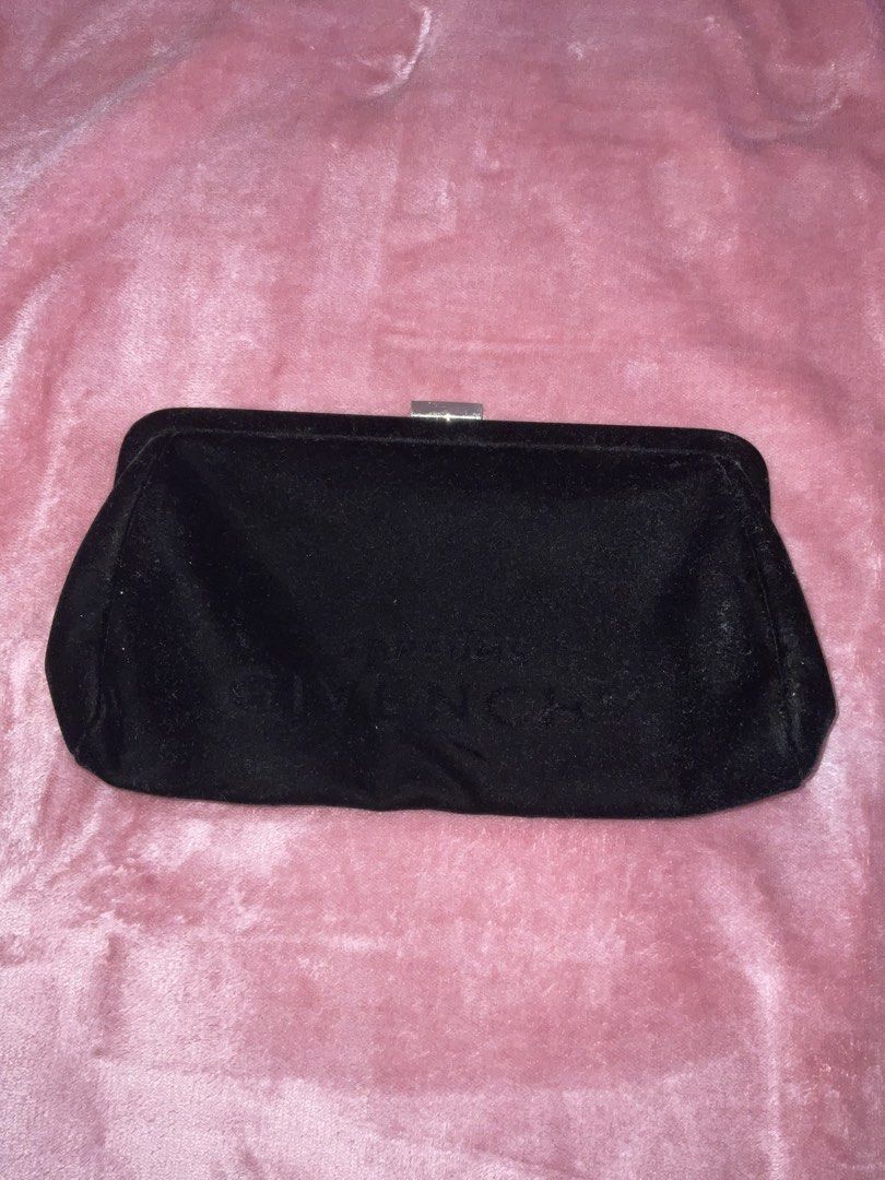 Givenchy Parfums Black Velvet Clutch Bag (Category: Luxury Bags & Wallets) located in Mangatarem. Submitted by rj4mmm (Listing ID 1466830920, Image 1). Description: - Brand: Givenchy Parfums - Material: Soft black velvet exterior with a structured frame - Clasp: Silver-tone kiss-lock with engraved Givenchy logo - Interior: Silver lining featuring a repeating monogram pattern with one slip pocket - Condition: 9.5/10 minimal lints visible (can be r