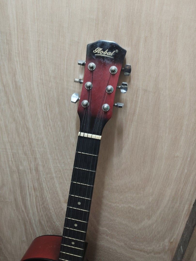 Global Guitar - Red (Category: Musical Instruments) located in Malabon City. Submitted by jetjay_30 (Listing ID 1466822718, Image 2). Description: Hi, i'm selling my old guitar, since i don't really use it, which i just chose to display in my room instead. I received it as a gift way back and just decided to let it go to someone passionate. Condition: - Lightly used - The string has never been replaced - Has light scratches - Lightly rusty (poor 