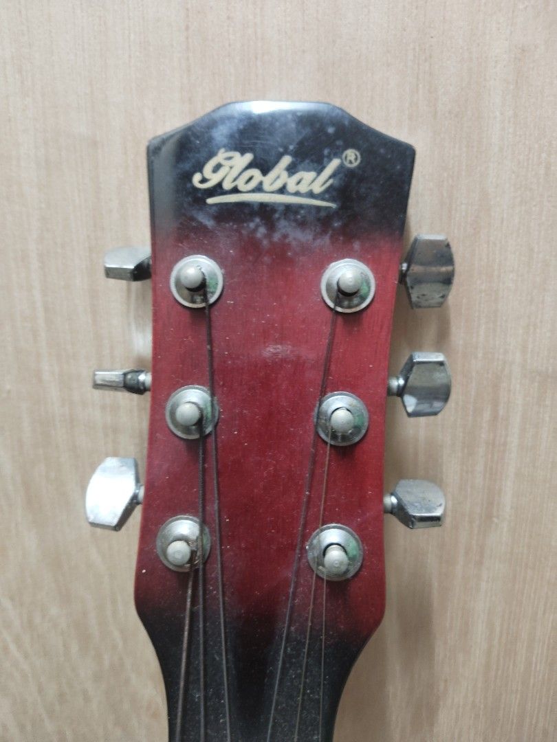 Global Guitar - Red (Category: Musical Instruments) located in Malabon City. Submitted by jetjay_30 (Listing ID 1466822718, Image 3). Description: Hi, i'm selling my old guitar, since i don't really use it, which i just chose to display in my room instead. I received it as a gift way back and just decided to let it go to someone passionate. Condition: - Lightly used - The string has never been replaced - Has light scratches - Lightly rusty (poor 