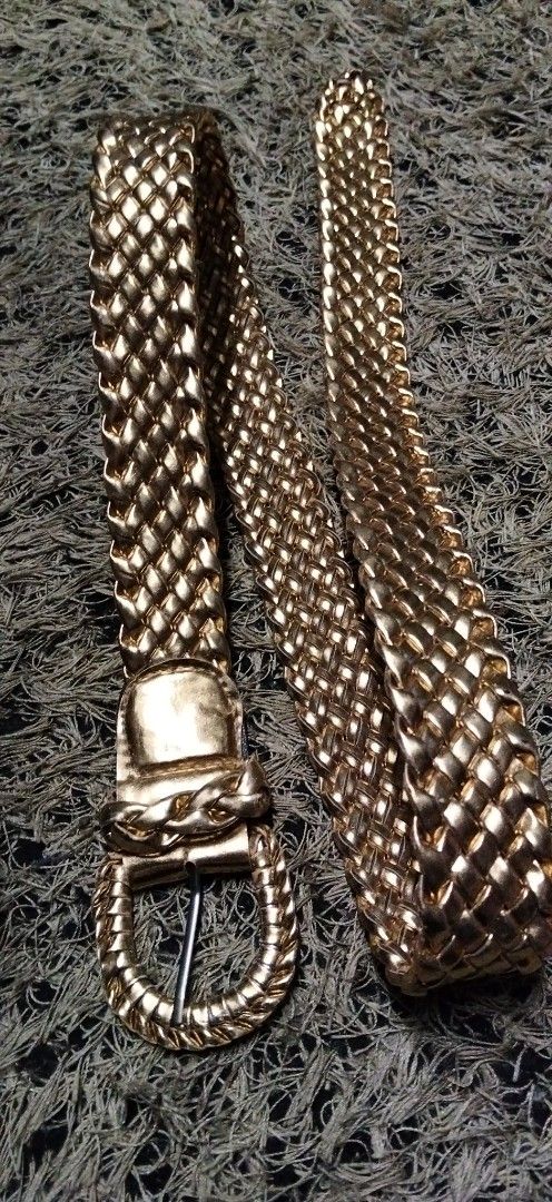 Gold braided metallic belt with buckle (Category: Belts) located in Paranaque City. Submitted by michael-08 (Listing ID 1466854473, Image 2). Description: - Bright gold metallic finish with an all-over woven braided texture - Features a sleek oval buckle and matching keeper loop - Standard pin closure for an adjustable, secure fit - Catch-the-light shiny design perfect for dressing up simple outfits WALA PO ISSUE GOOD GONDITION WALANG TULAP BAKBA
