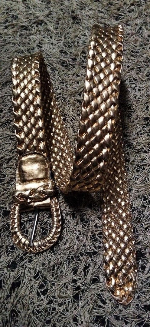 Gold braided metallic belt with buckle (Category: Belts) located in Paranaque City. Submitted by michael-08 (Listing ID 1466854473, Image 1). Description: - Bright gold metallic finish with an all-over woven braided texture - Features a sleek oval buckle and matching keeper loop - Standard pin closure for an adjustable, secure fit - Catch-the-light shiny design perfect for dressing up simple outfits WALA PO ISSUE GOOD GONDITION WALANG TULAP BAKBA