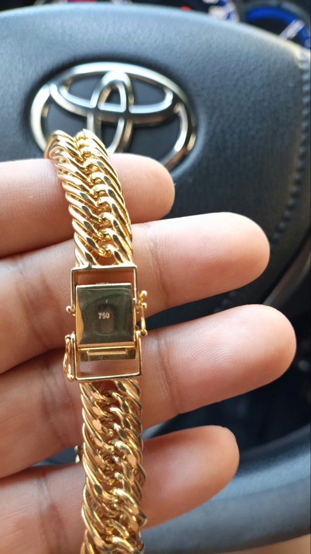 Gold Cuban Link Chain Bracelet with Clasp (Category: Jewelry) located in Manila. Submitted by shemineforever (Listing ID 1466777068, Image 3). Description: - Style: Classic chunky gold-tone curb link bracelet - Design: Heavy interlocking pattern with polished links - Closure: Secure box clasp on the end - Condition: Worn a few times, with slight scuff marks on the clasp surface.