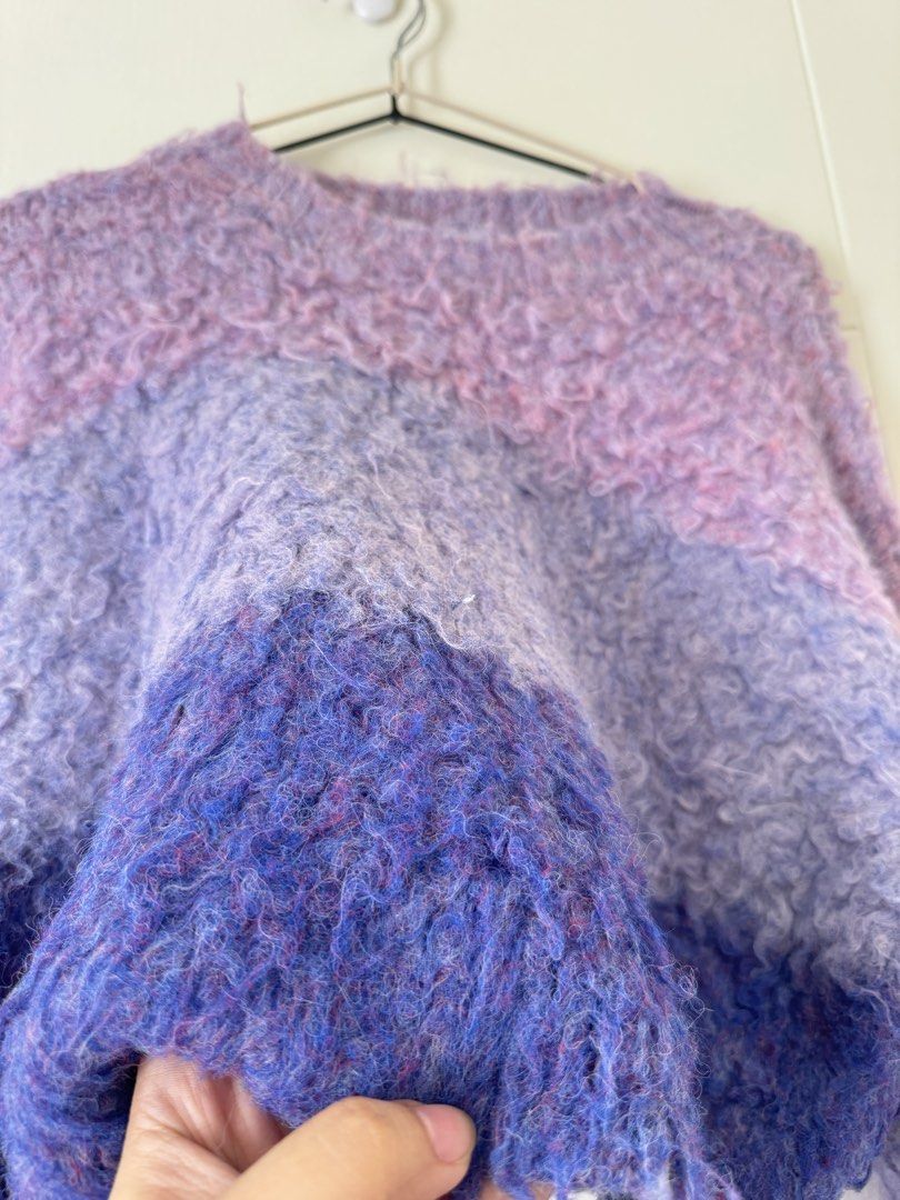 Gradient Purple Fuzzy Knit Sweater Cropped Pullover (Category: Longsleeves) located in Mandaluyong City. Submitted by trinket.ph (Listing ID 1466775005, Image 2). Description: - Colorway: Purple gradient (light pastel lilac to deep royal violet) - Material: Soft textured wool blend with a fuzzy, curly mohair-like feel - Fit: Cropped style with crew neck and long sleeves - Condition: Brand new / Excellent - Perfect cozy layering piece for the cool