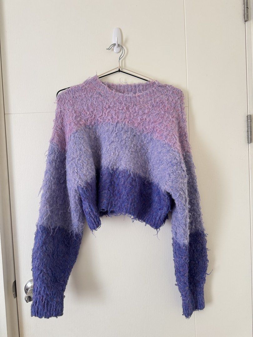 Gradient Purple Fuzzy Knit Sweater Cropped Pullover (Category: Longsleeves) located in Mandaluyong City. Submitted by trinket.ph (Listing ID 1466775005, Image 1). Description: - Colorway: Purple gradient (light pastel lilac to deep royal violet) - Material: Soft textured wool blend with a fuzzy, curly mohair-like feel - Fit: Cropped style with crew neck and long sleeves - Condition: Brand new / Excellent - Perfect cozy layering piece for the cool