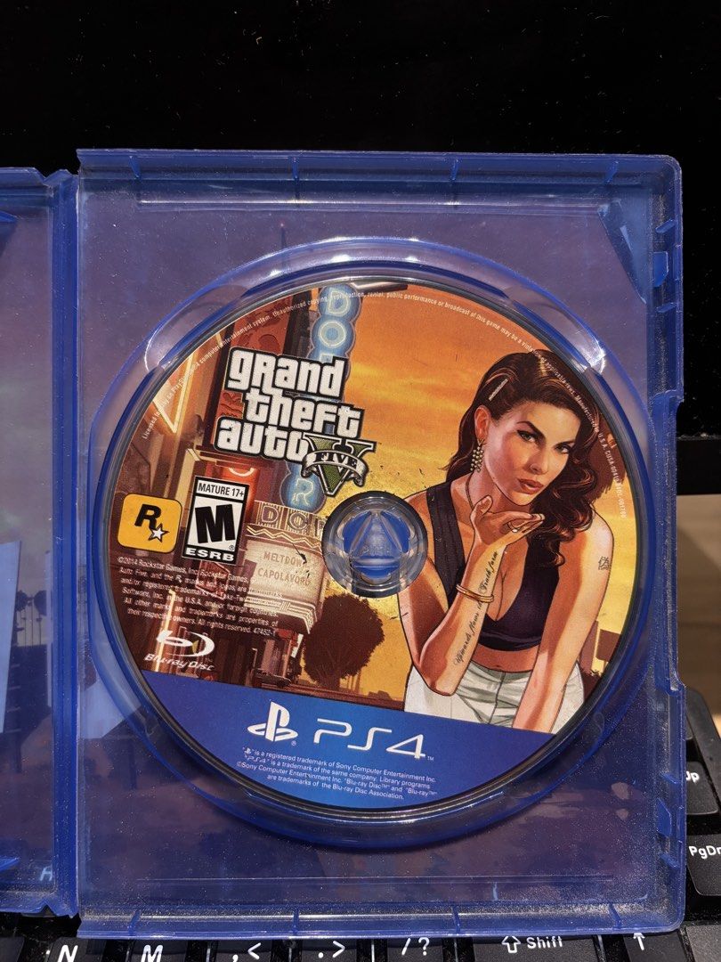 Grand Theft Auto V (GTA 5) PS4 Game (Category: PlayStation) located in Pasuquin. Submitted by gabelli.declutters (Listing ID 1466830699, Image 2). Description: Grand Theft Auto V (GTA 5) PS4 Game Brand: PlayStation / Rockstar Games Game Title: Grand Theft Auto V Platform: PS4 (PlayStation 4) Genre: Action-Adventure / Open-World Mode: Single-Player & Online Multiplayer (2–30 Players) Storage Required: 55 GB minimum ESRB Rating: Mature 17+ (Intense