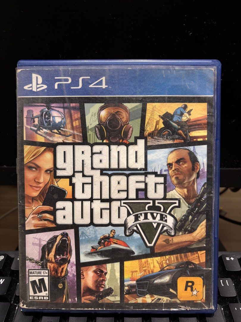 Grand Theft Auto V (GTA 5) PS4 Game (Category: PlayStation) located in Pasuquin. Submitted by gabelli.declutters (Listing ID 1466830699, Image 1). Description: Grand Theft Auto V (GTA 5) PS4 Game Brand: PlayStation / Rockstar Games Game Title: Grand Theft Auto V Platform: PS4 (PlayStation 4) Genre: Action-Adventure / Open-World Mode: Single-Player & Online Multiplayer (2–30 Players) Storage Required: 55 GB minimum ESRB Rating: Mature 17+ (Intense