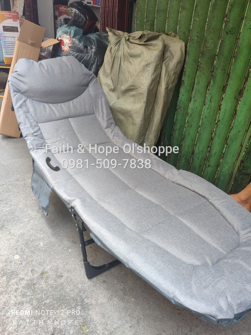 Gray Foldable Single Lounge Bed Recliner Cot (Category: Bed Frames & Mattresses) located in Manila. Submitted by jamfrimzy089458 (Listing ID 1466796952, Image 3). Description: - Versatile gray foldable lounge bed ideal for guests, office naps, or relaxing outdoors - Adjustable backrest transitions easily from sitting to a full flat sleeping position - Thick padded cushion for ultimate comfort - Built-in side pocket to keep your phone, books, or e