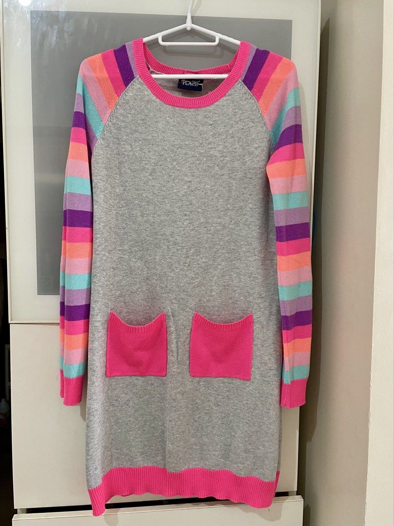 Gray Striped Knitted Sweater Dress (Category: Dresses) located in Taguig. Submitted by lam_decluttering (Listing ID 1466797980, Image 1). Description: - Enid Sinclair inspired look for Halloween - Teen Style: Gray knit sweater dress with fun, colorful striped sleeves (purple, pink, orange, turquoise) - Details: Hot pink ribbed trim on collar, cuffs, hem, and two functional front patch pockets - Material: Super soft and cozy fabric perfect for eve