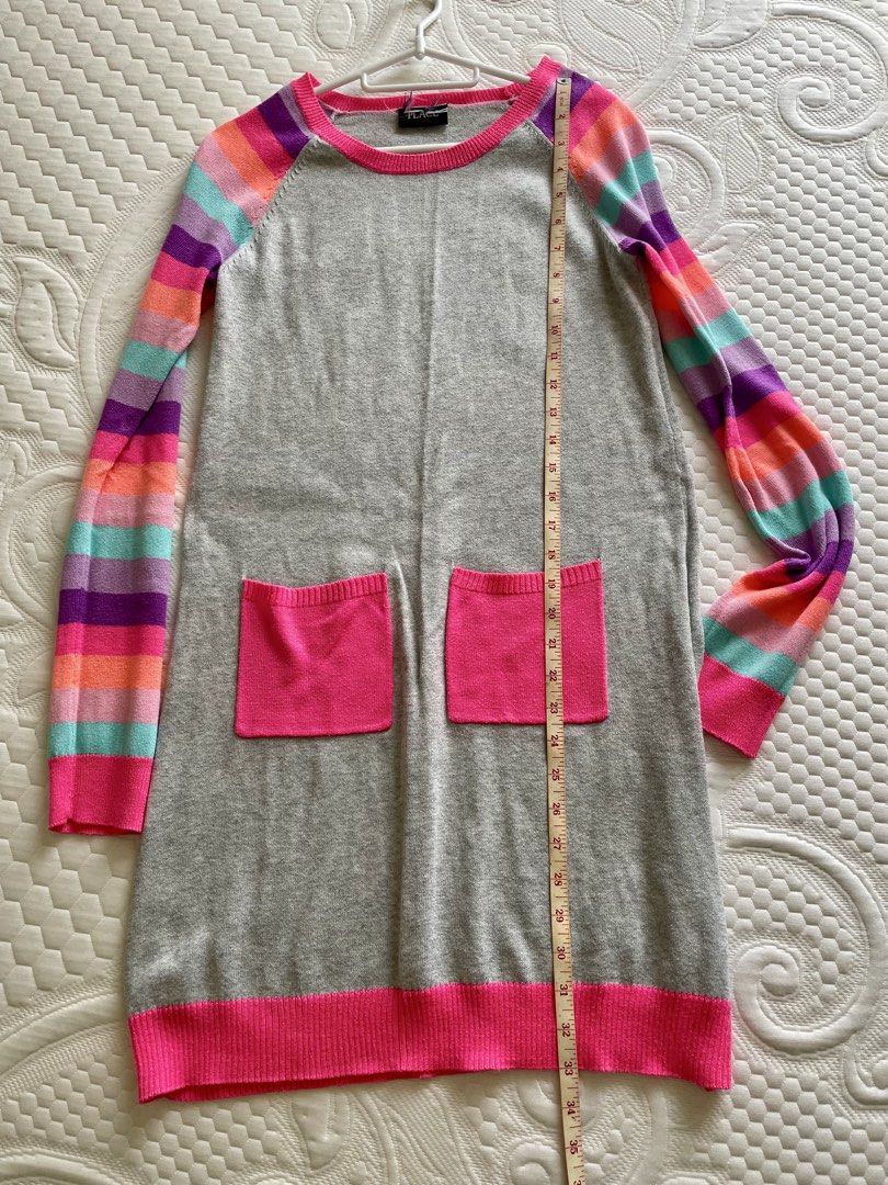 Gray Striped Knitted Sweater Dress (Category: Dresses) located in Taguig. Submitted by lam_decluttering (Listing ID 1466797980, Image 2). Description: - Enid Sinclair inspired look for Halloween - Teen Style: Gray knit sweater dress with fun, colorful striped sleeves (purple, pink, orange, turquoise) - Details: Hot pink ribbed trim on collar, cuffs, hem, and two functional front patch pockets - Material: Super soft and cozy fabric perfect for eve