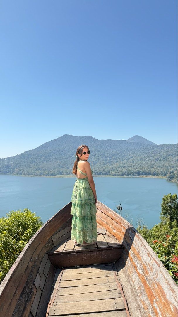 Green Tiered Halter Maxi Dress (Category: Dresses) located in Las Pinas. Submitted by fabmommas (Listing ID 1466869462, Image 3). Description: - Color & Pattern: Grass green with a watercolor abstract print - Style: Halter neck, deep V-cut, zippered, tiered ruffles, can be worn in different styles - Fabric: Lightweight, flowy chiffon that moves beautifully - Occasion: Ideal for vacations, beach trips, and outdoor photoshoots - Condition: Worn onc