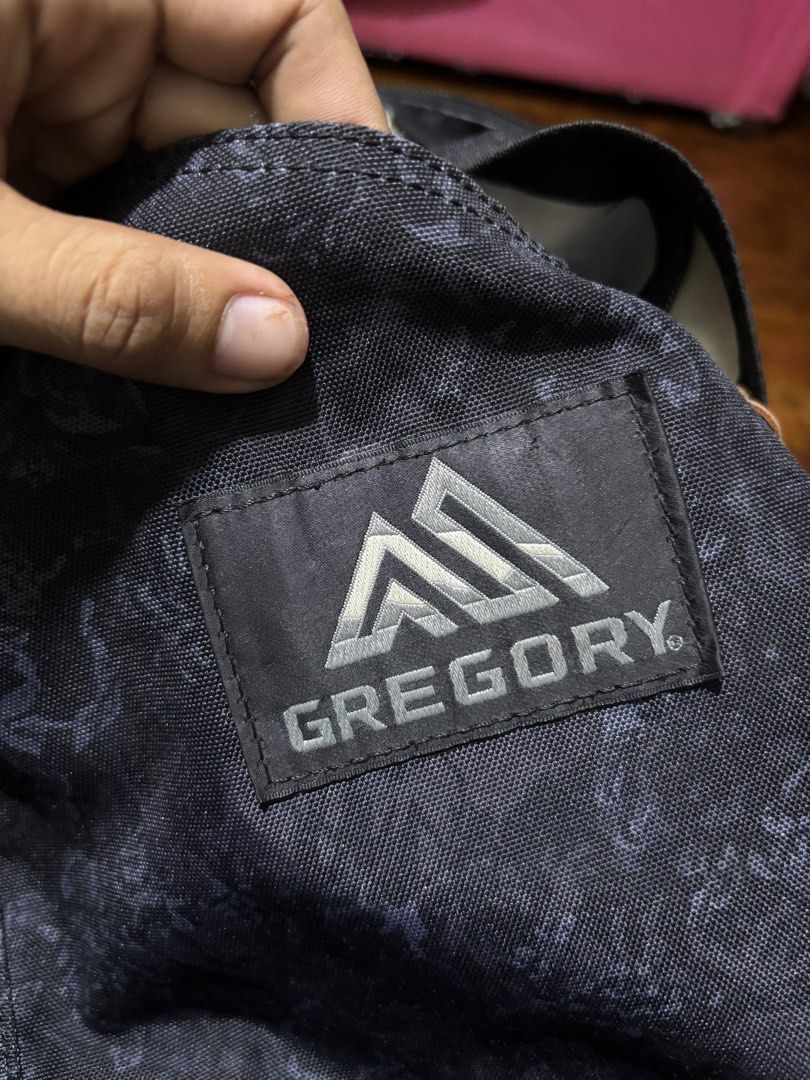 Gregory Black Floral Backpack (Category: Backpacks) located in Malaybalay. Submitted by ziggyy. (Listing ID 1466869905, Image 3). Description: - Brand: Gregory - Design: Dark floral pattern with solid black base - Hardware: Sturdy YKK zippers with leather pull tabs - Straps: Adjustable padded shoulder straps with quick-release buckles and D-ring - Storage: Front zipped pocket for easy access - Details: Signature Gregory branded patch on the front