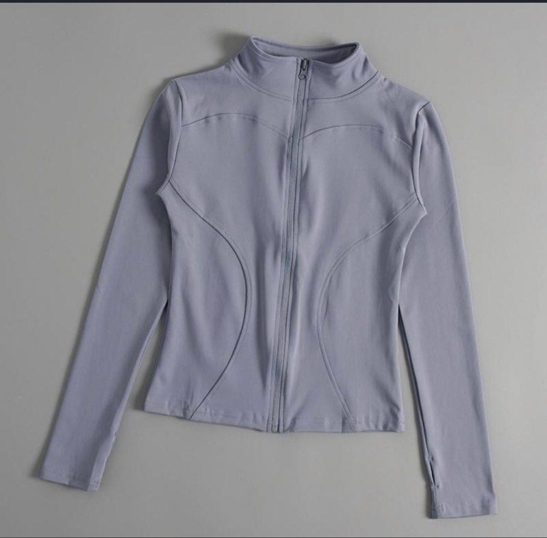 Grey Activewear Zip-Up Jacket with Thumbholes (Category: Activewear) located in Pasig City. Submitted by deedee235 (Listing ID 1466882630, Image 1). Description: - Colour: Grey - Style: Athletic zip-up jacket with high collar and contoured seams - Features: Long sleeves with thumbholes, full-length front zipper - Material: Smooth, stretchy fabric - Condition: Clean and ready to wear - Versatility: Great for workouts or casual everyday use.