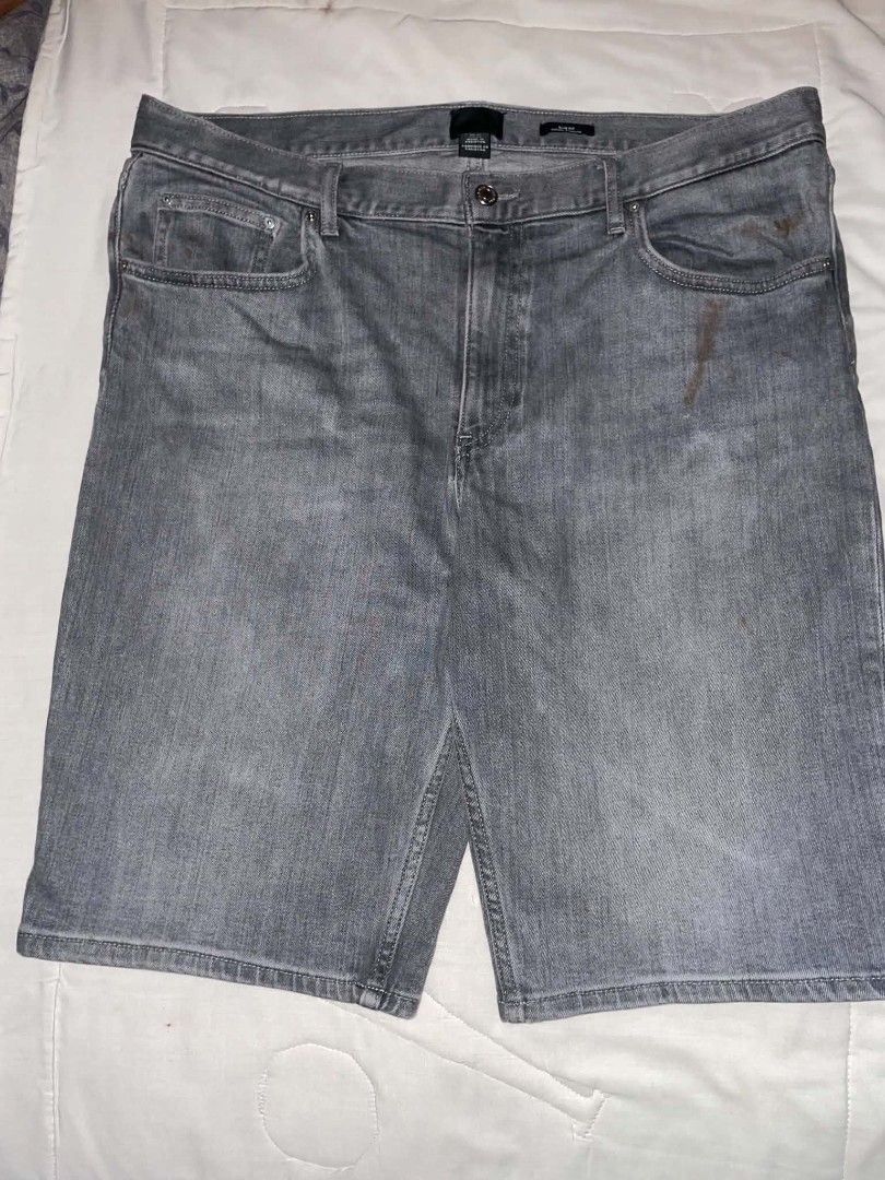 Grey denim shorts slim fit men (Category: Shorts) located in Manila. Submitted by lamawpaul (Listing ID 1466951833, Image 1). Description: - Style: Grey denim shorts with a slim fit cut and faded wash look - Closure: Standard button and zipper fly with belt loops - Pockets: Classic five-pocket setup (front and rear) - Condition: Good overall, but please note visible brownish stains on the upper front right side - Perfect for casual everyday wear!