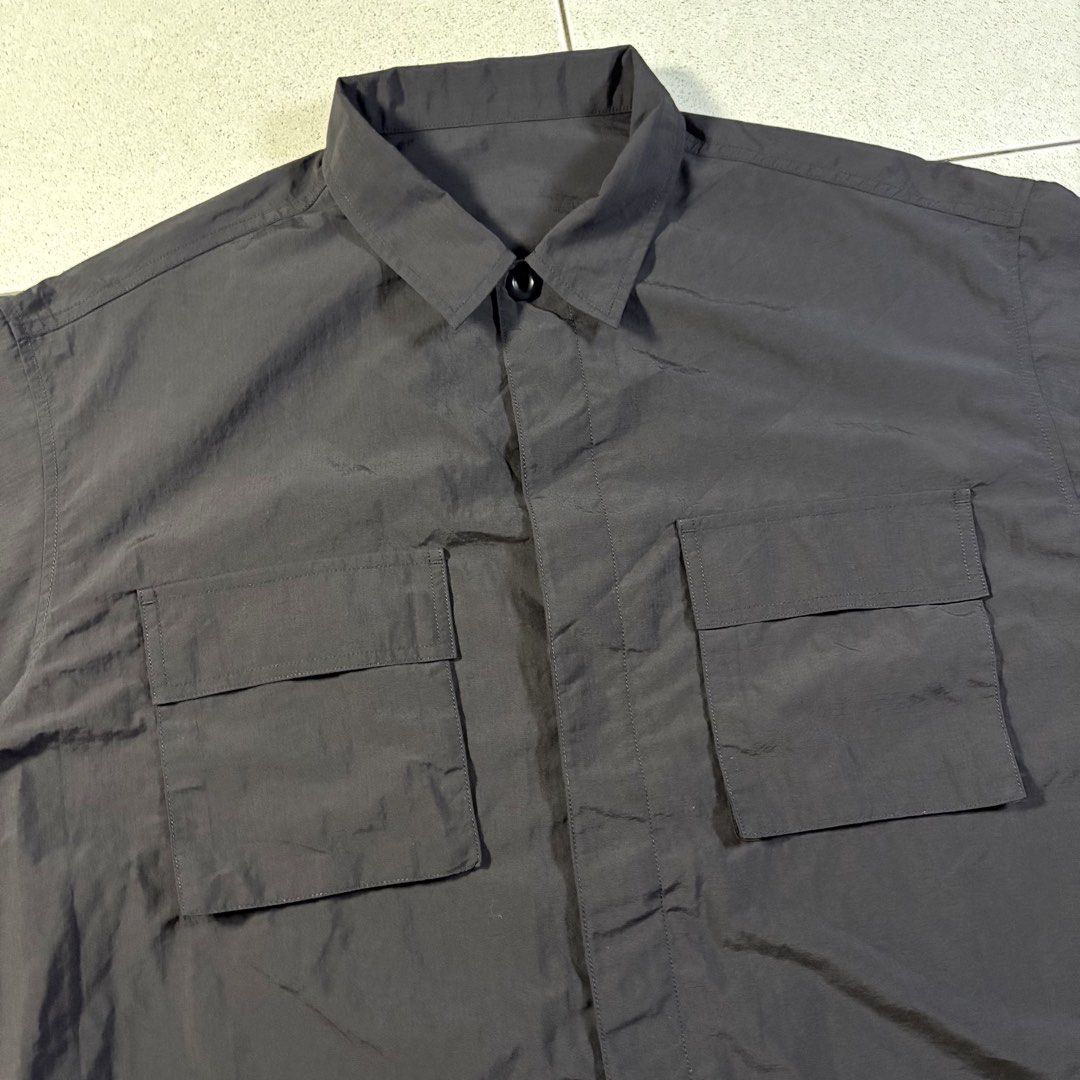 GU JP CPO Button-down Polo in Black (Category: Formal Shirts) located in Manila. Submitted by yama_archive (Listing ID 1466908185, Image 3). Description: GU JP CPO Button-down Polo in Black Dimes (inches starting from 0) — - Size on tag: XL (can fit up to XXL) - Width: 27 - Length: 29.5 - Shoulders: 22 - Sleeves: 11.5 - Fabric: Ripstop Nylon ₱1000 Issues: ❌ Condition: 10/10 Color Rate: 10/10.