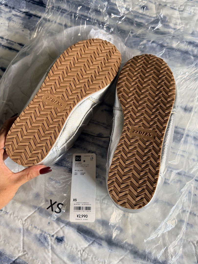 GU Silver Double Shoelace Flat Sneakers Size XS (Category: Sneakers) located in Marikina City. Submitted by themissusdeclutters (Listing ID 1466850014, Image 3). Description: - Brand: GU (Japan bought) - Flat sneakers in silver with white and dark blue double shoelaces - Size: XS (fits 22.0 cm) - JP 22 / EU 34 / US 5 per inner tag - Synthetic leather upper with durable rubber soles - Brand new, never worn, still in original plastic packaging - Ti