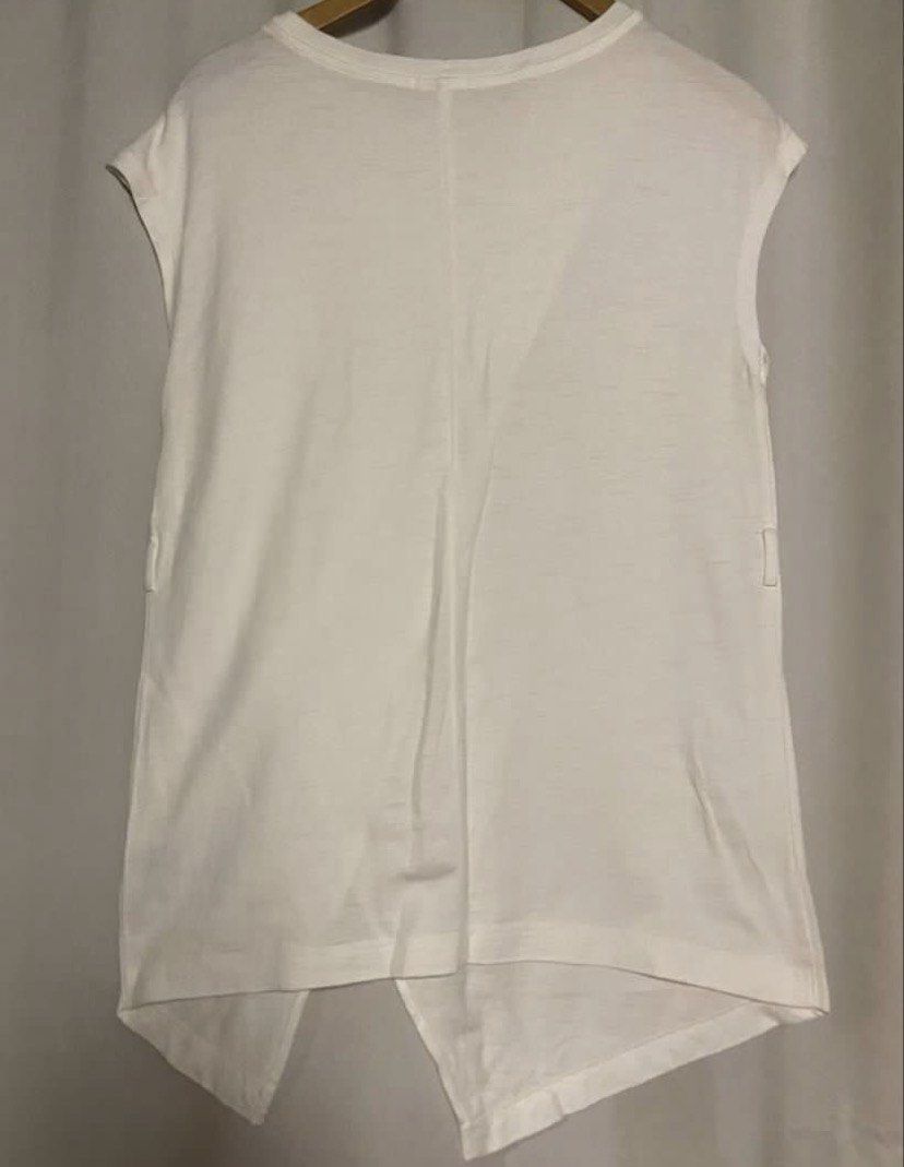 GU White Asymmetrical Split Front Top (Category: Sleeveless) located in Caloocan City. Submitted by declutteringph. (Listing ID 1466839077, Image 3). Description: Size S on the tag! Dimensions: (inches) Bust width: 19” Body Length: 31”.