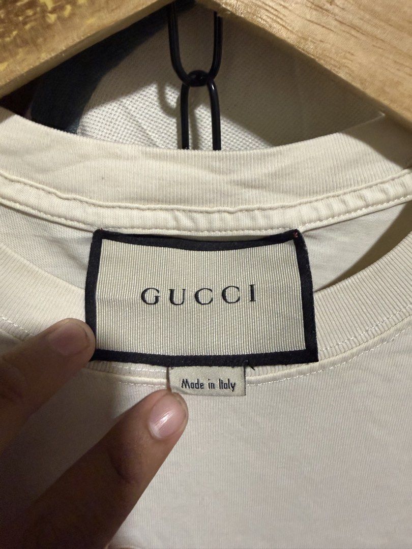 Gucci (Category: Tshirts & Polo Shirts ) located in Odiongan. Submitted by shannnthrifts (Listing ID 1466925875, Image 3). Description: Gucci Good condition Issue: pin hole neck side, need wash 20.5x27-28 Cr 9.8/10 Complete tags ₱400 freeshipping Drop your offer.