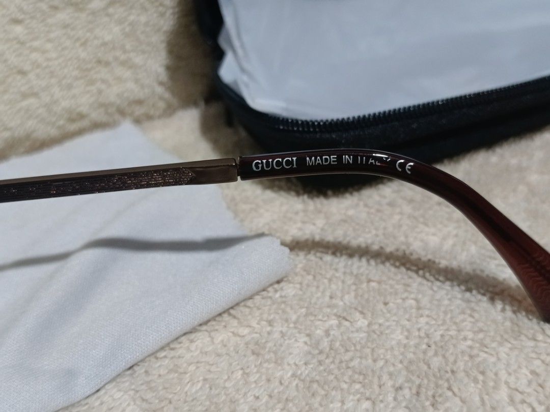 Gucci 2A722 Aviator Sunglasses Brown Gradient Lenses (Category: Sunglasses & Eyewear) located in Cavite. Submitted by navias (Listing ID 1466799975, Image 2). Description: Origin:UAE Gucci aviator sunglasses with brown gradient lenses and bronze metal frames. Model 2A722 55-17-141 stamped on the inner temple arm. Includes black hard shell zipper case and white cleaning cloth. Classic double bridge design with subtle Gucci branding on the arms.sup