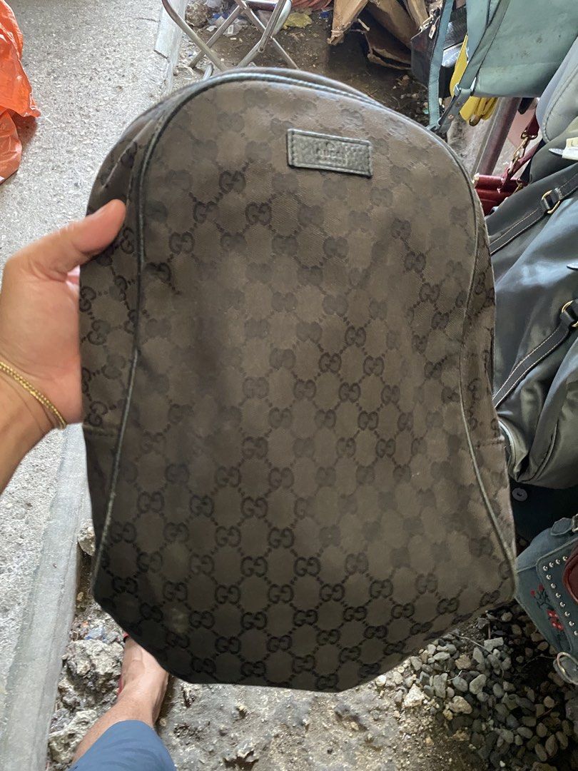 Gucci GG Supreme Canvas Backpack (Category: Backpacks) located in Alburquerque. Submitted by zanegavynn43872 (Listing ID 1466806632, Image 1). Description: - Authentic Gucci backpack not guarantee in classic black GG monogram canvas - Features a front leather patch with embossed branding - Secure zipper closure with branded hardware pulls - Durable fabric interior lining with an inner pocket - Includes interior leather tag with serial number 4499