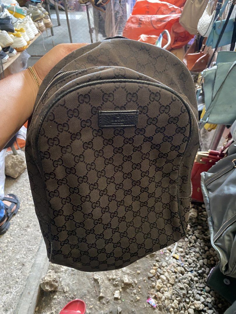 Gucci GG Supreme Canvas Backpack (Category: Backpacks) located in Alburquerque. Submitted by zanegavynn43872 (Listing ID 1466806632, Image 2). Description: - Authentic Gucci backpack not guarantee in classic black GG monogram canvas - Features a front leather patch with embossed branding - Secure zipper closure with branded hardware pulls - Durable fabric interior lining with an inner pocket - Includes interior leather tag with serial number 4499